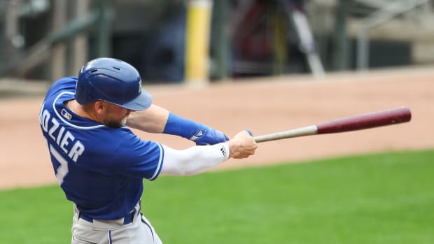 May 2, 2021; Minneapolis, Minnesota, USA; Kansas City Royals third baseman Hunter Dozier (17) hits a three-run home run against the Minnesota Twins in the fourth inning at Target Field. Mandatory Credit: David Berding-USA TODAY Sports
